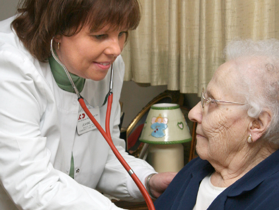 An A&D registered nurse caring for a patient at home